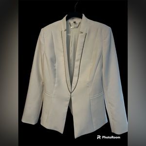 White House Black Market women’s size 4 blazer in white with silver trim.